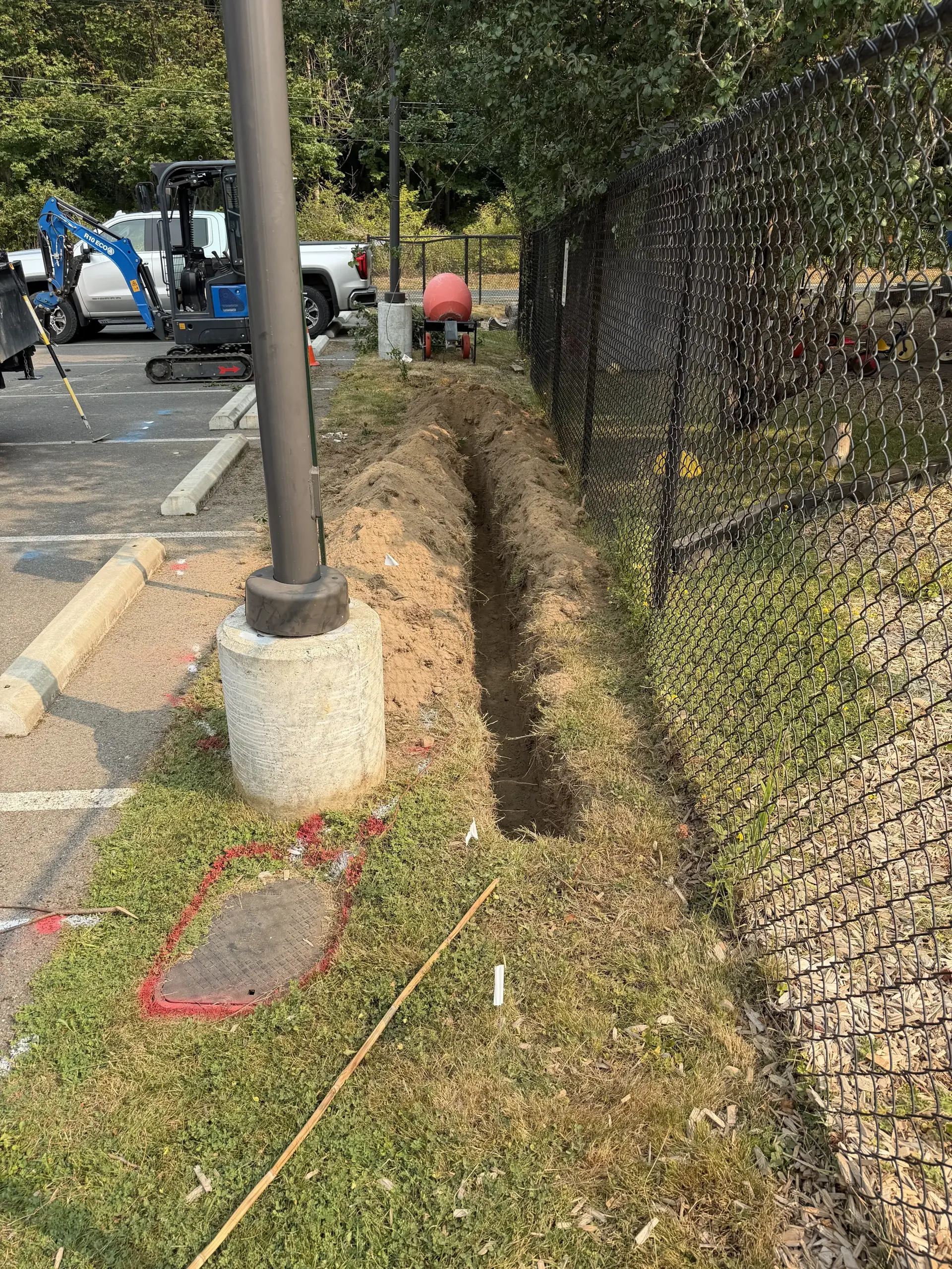 Clean utility trench cut through a residential lot