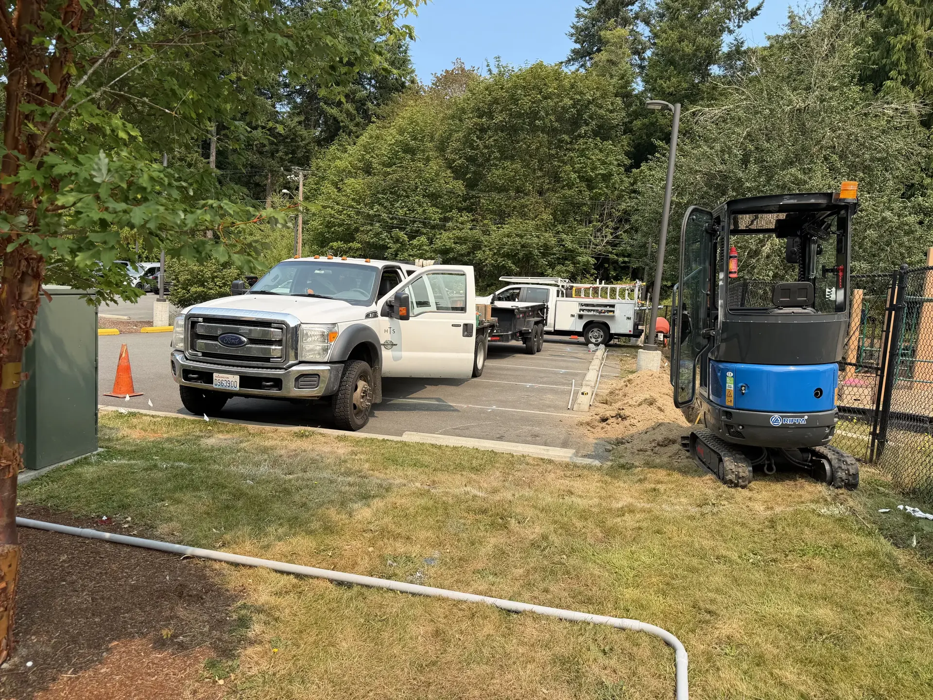 Loader and truck working a dirt construction lot
