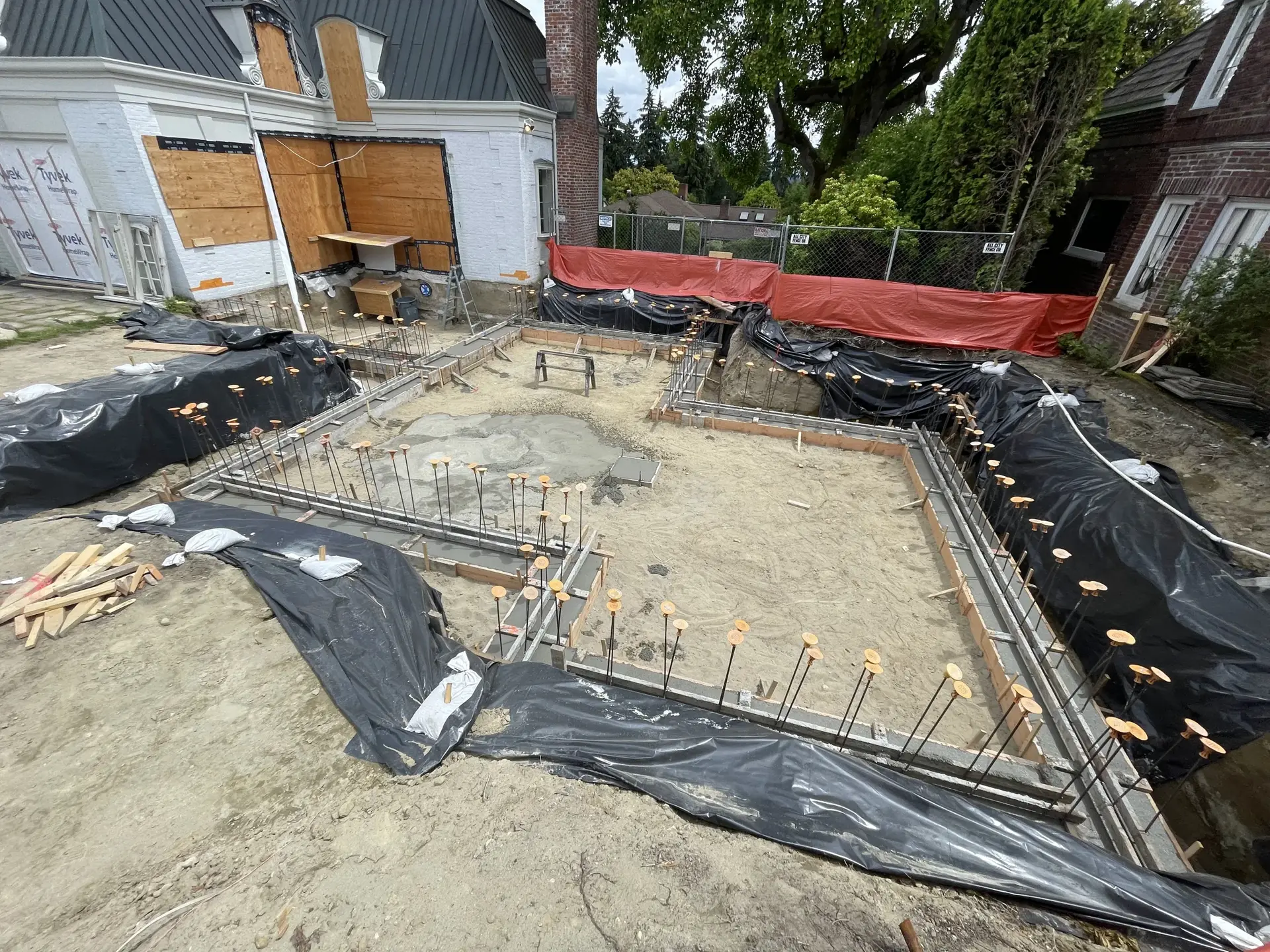 Custom foundation forms and rebar layout ready for pour — HTS Concrete & Construction