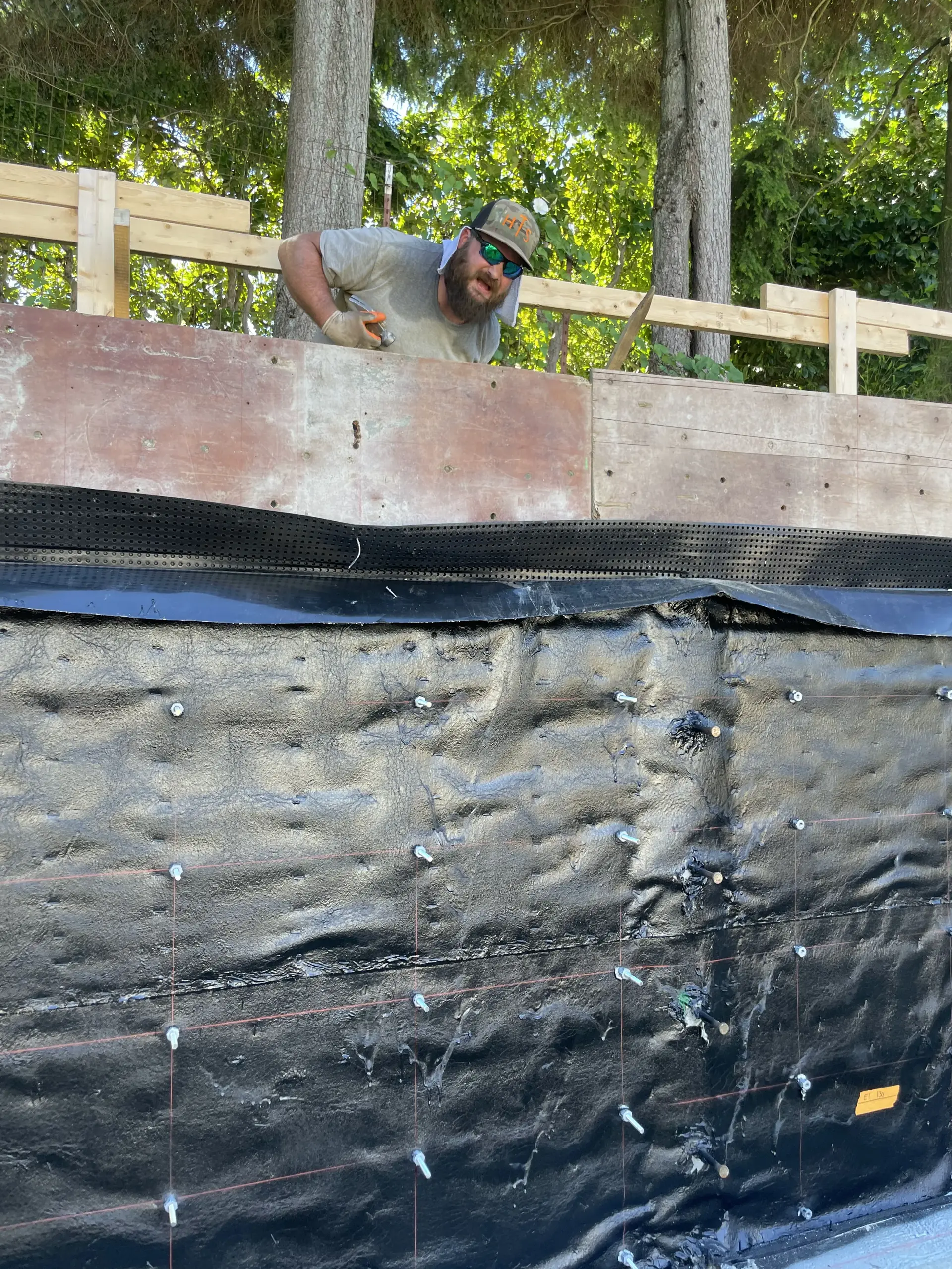 Foundation waterproofing membrane and formwork on a tall wall — HTS Concrete & Construction