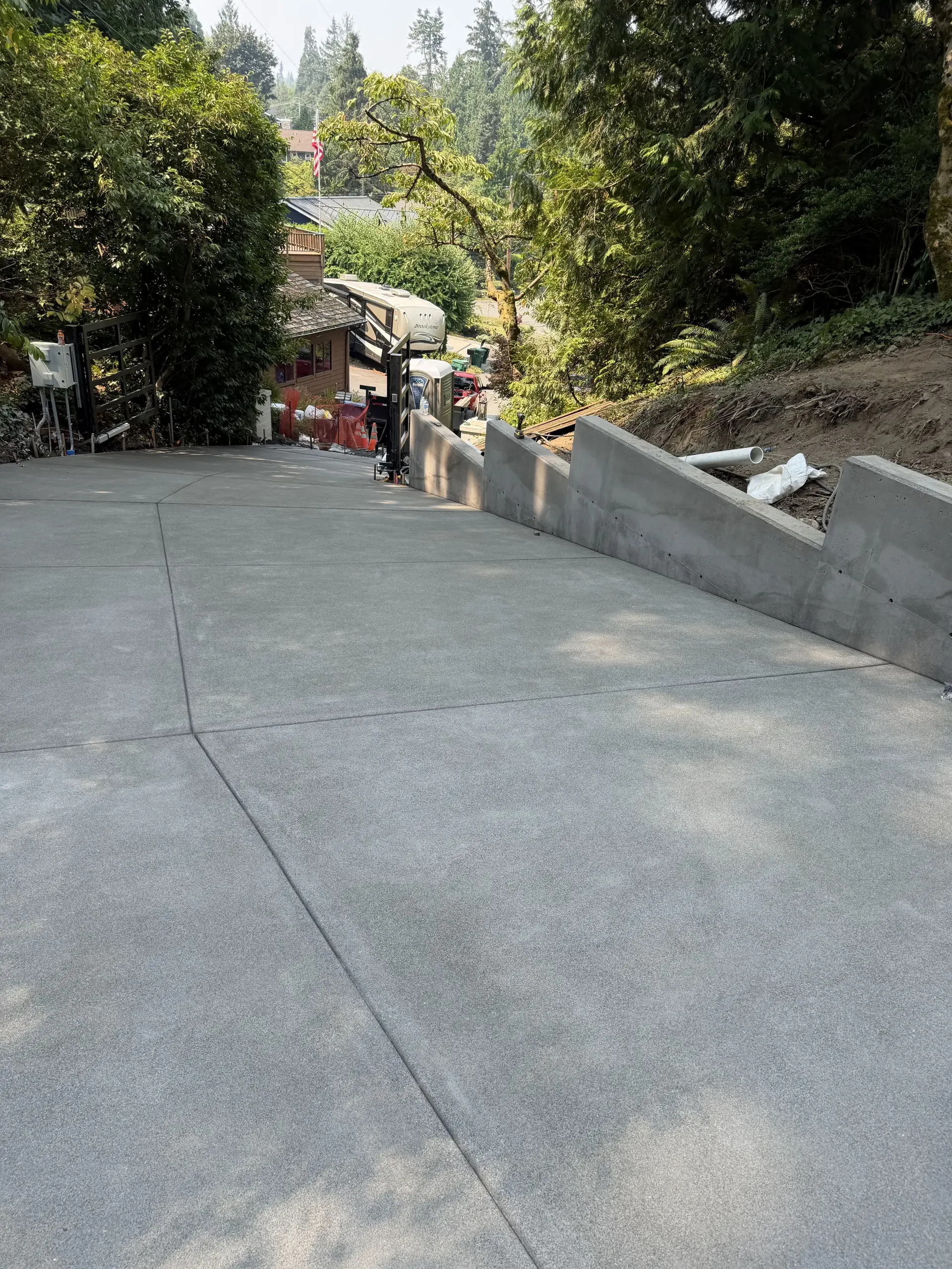 Sloped driveway with stepped retaining wall
