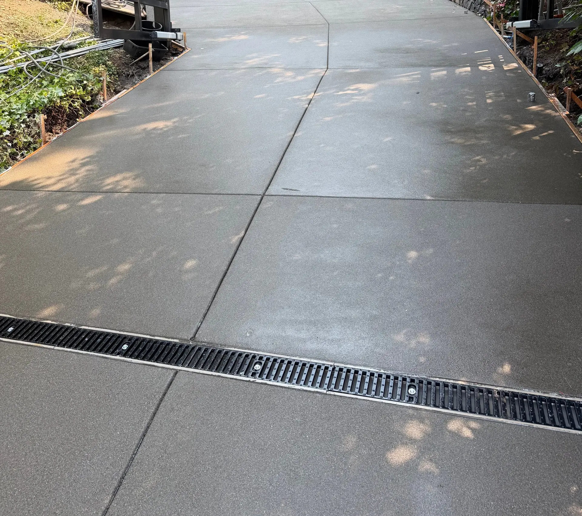 Sloped concrete driveway with a trench drain
