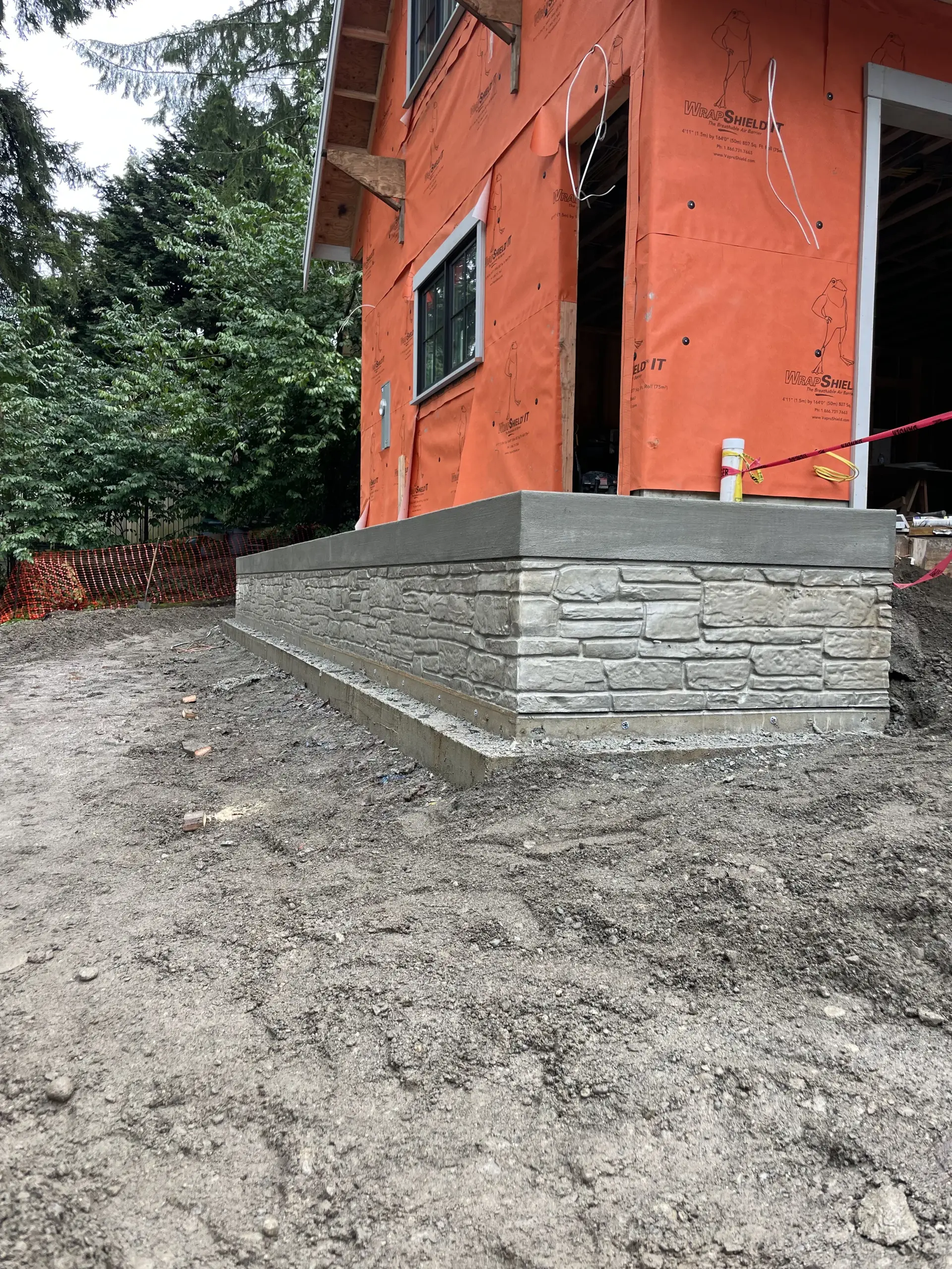 Decorative stamped-stone foundation wall