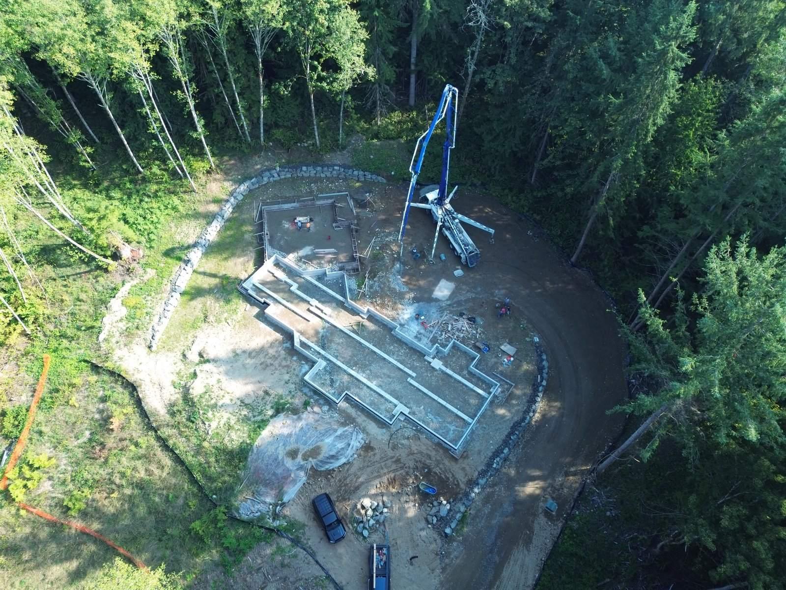Aerial view of a custom residential foundation pour with concrete pump — HTS Concrete & Construction