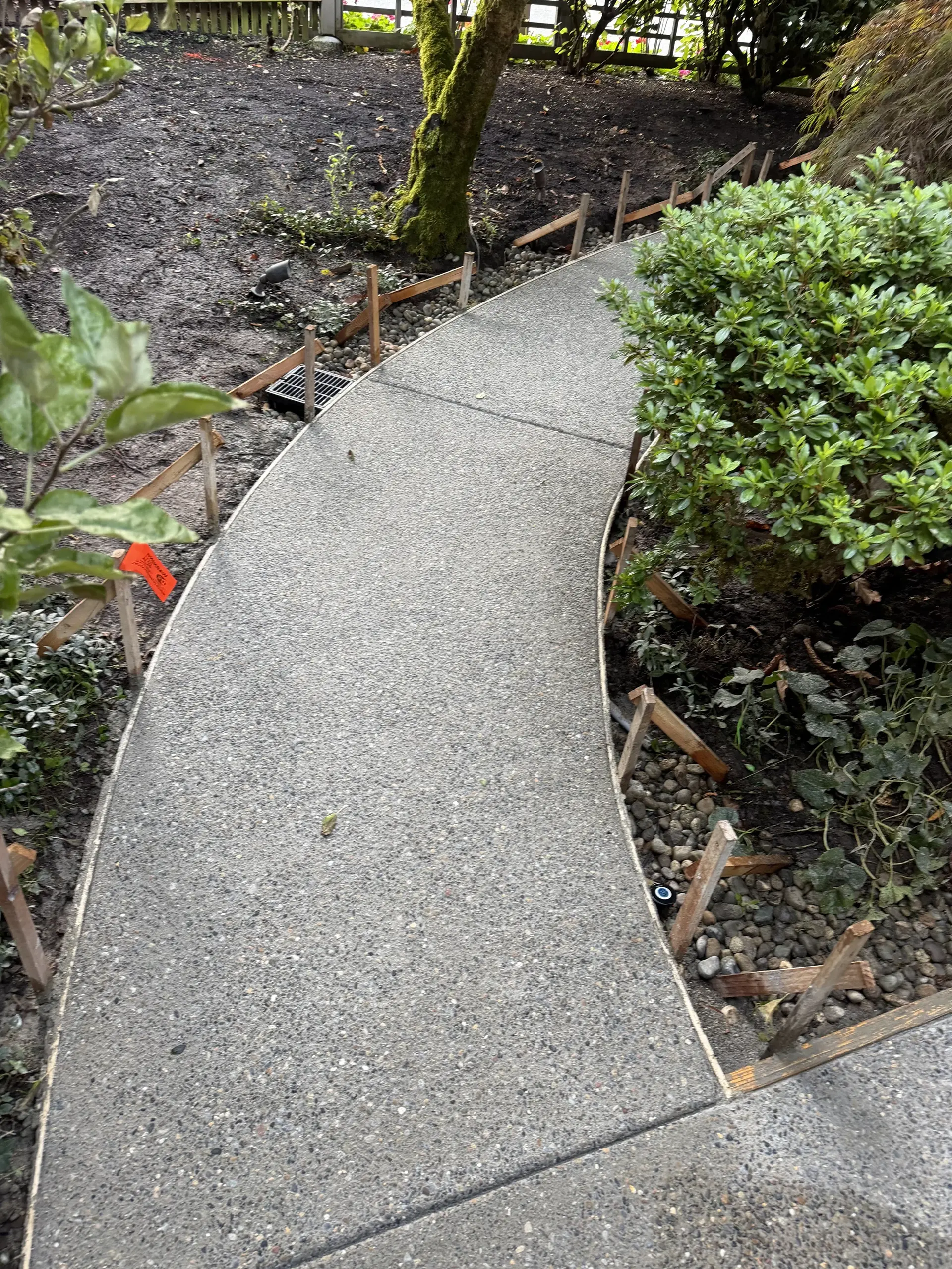 Curved exposed aggregate concrete walkway