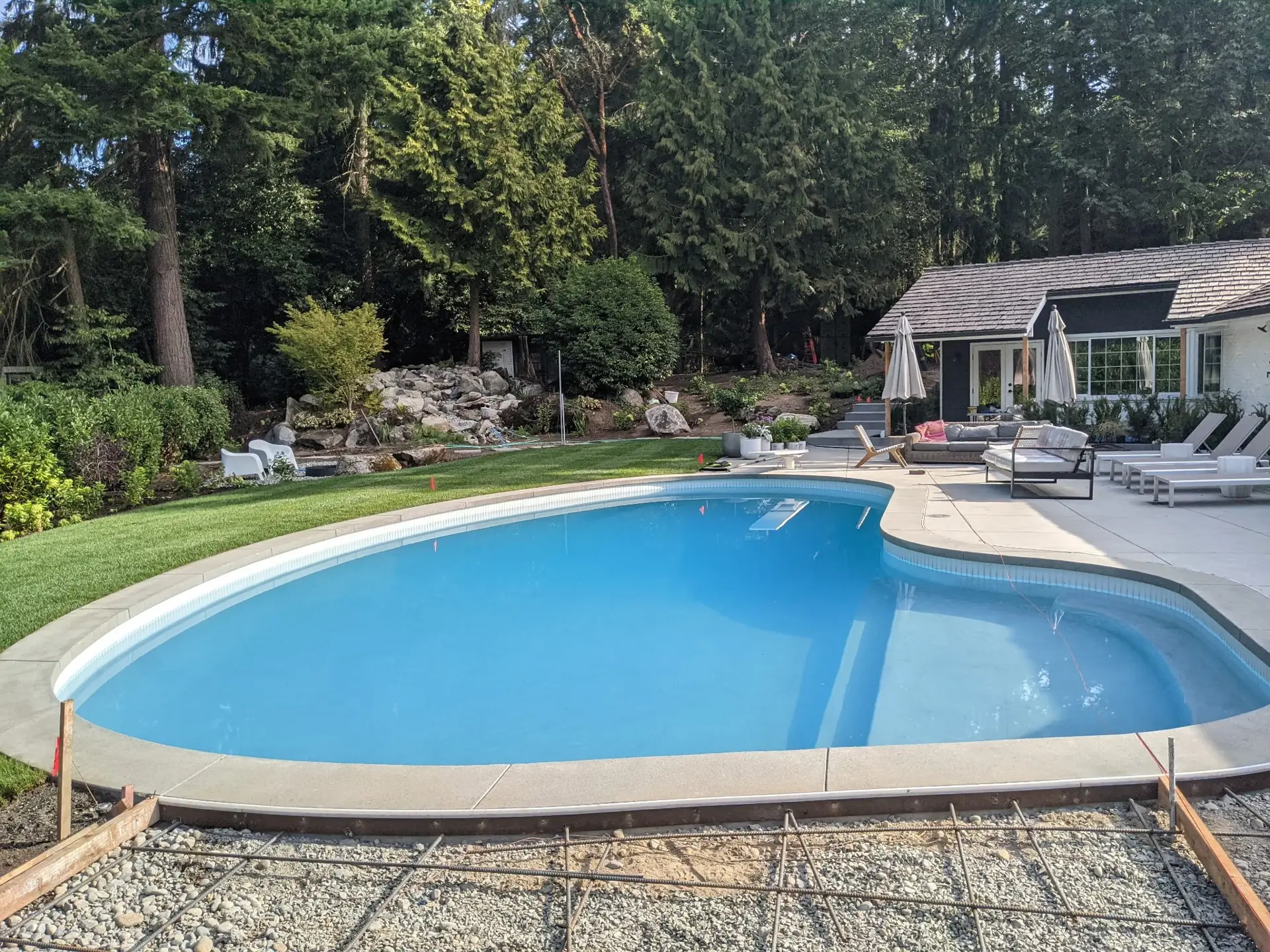 Finished concrete pool deck and surround at a Puget Sound home